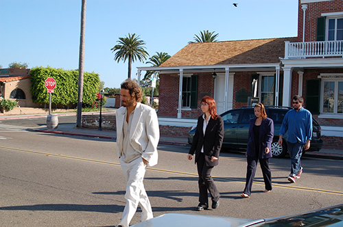 scic staff walking across road, recreating abbey road photo